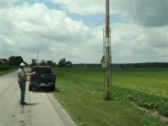 Dick Phillips lowers a Kestrel box for cleaning