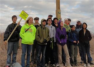 The entire group poses in front of the new nesting platform