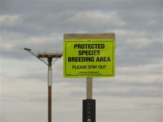 A sign warns visitors to keep their distance