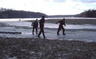 January 18, 1997: From left, Jerry Geist, Roger Koch and Matt Wallschlaeger pull a utility pole across Alum Creek’s frozen mud flat. Consolidated Electric Coop delivered three poles to support the effort to attract nesting Osprey.