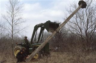 April 10, 1982: Chief Ranger Dave Nicholas operates Delaware State Park’s tractor as Ranger Ken Hay guides the county’s first Osprey pole into the ground.