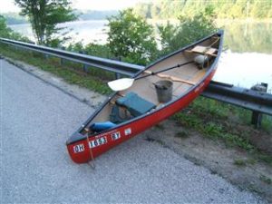 Ready to launch the kayak over the guardrail